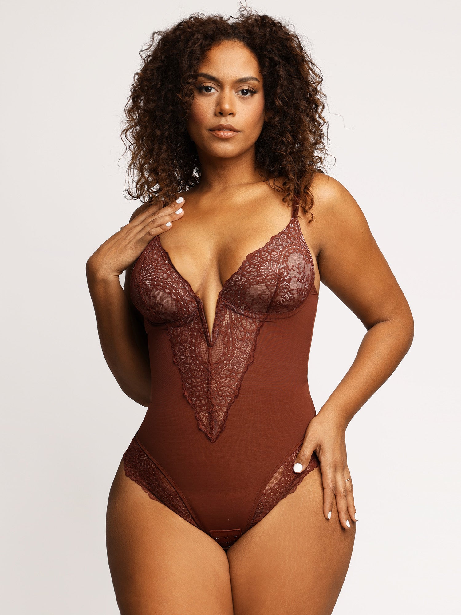 Made with breathable, high-elastic, and double-layer fabric, the Deep-V Neck Lace Thong Shapewear Bodysuit offers comfortable shaping for a smooth, flattering silhouette.