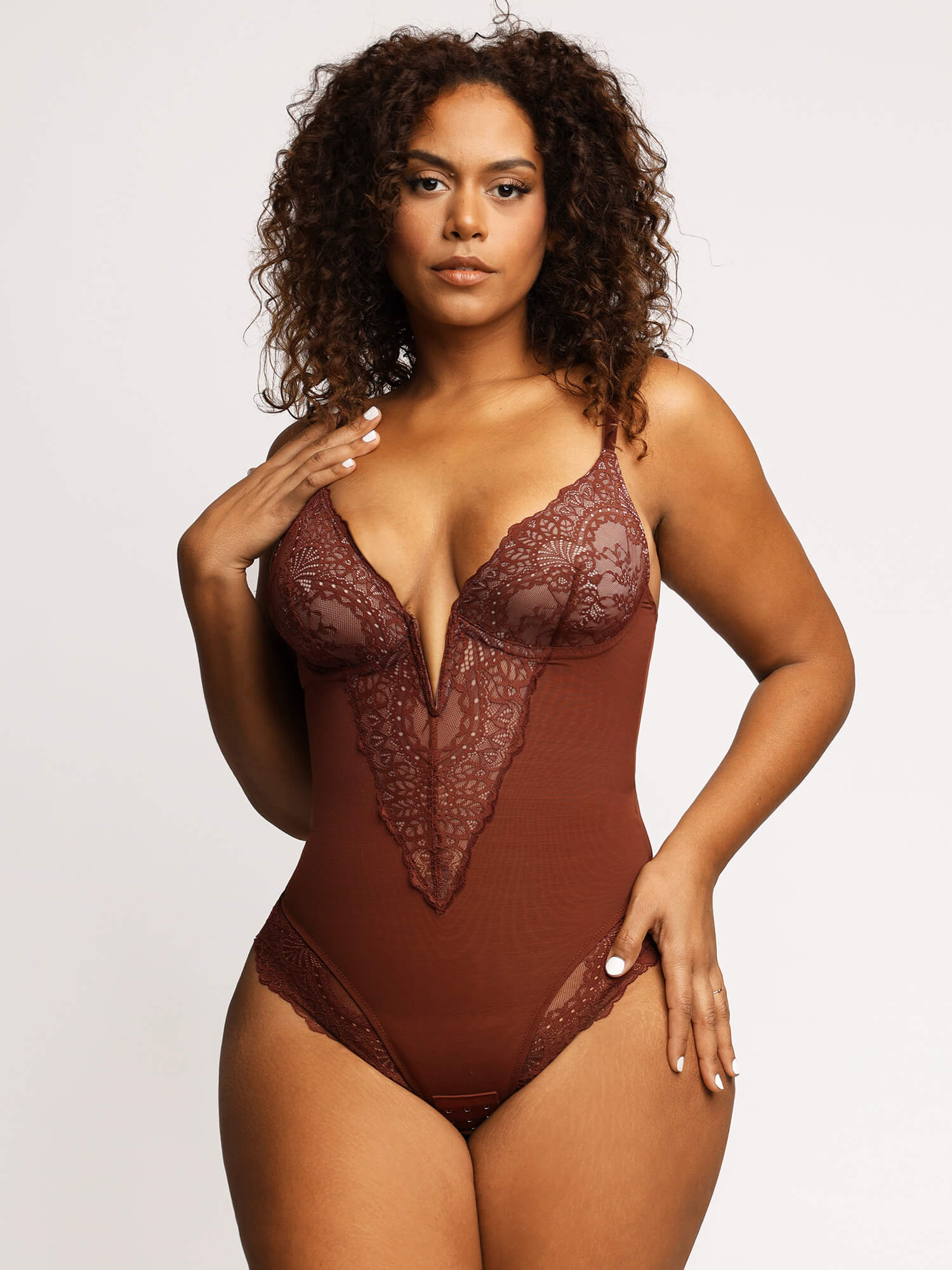 The Deep-V Neck Lace Thong Shapewear Bodysuit offers shaping for a flattering silhouette.