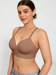 Woman wearing a seamless, wireless, mocha-colored comfort smoothing bra with built-in cups.