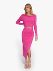 Woman in pink Popilush® off-the-shoulder top and skirt set, high waisted for slimming look.