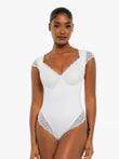 Elegant white shapewear with cap sleeves from Popilush®, for confidence and style.