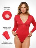 Red long-sleeve thermal shapewear bodysuit with deep V-neck, button front, and built-in tummy control.