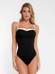 Black shapewear bodysuit with white contrast V-neck trim and adjustable straps.