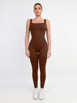 Brown square neck workout jumpsuit with built-in thigh slimming shapewear.