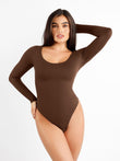 Woman in brown Popilush® bodysuit, showcasing the smooth shapewear.