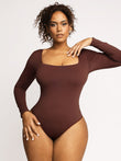 Brown long sleeve square neck shapewear bodysuit with tummy control features.