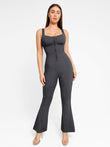 Sculpting denim jumpsuit with square neckline, zipper front, and flare legs.