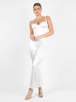 White shapewear jumpsuit with flare legs by Popilush®. Chic and comfortable.