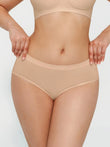 Nude seamless high-waist briefs with gentle support and second-skin feel.