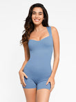 Stylish blue shapewear romper, fit from Popilush®; woman smiling