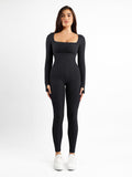 Modern fashion: Black square neck long sleeve Popilush® jumpsuit with thumb holes.