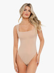 Nude square neck sleeveless bodysuit with a smooth finish, showing its flattering cut and button closure at the crotch.