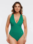 Green cross-front halter tummy control bodysuit with ruched bust and vertical ribbing.