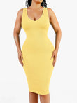 Yellow deep V-neck midi dress with ribbed texture, featuring tummy control and a flattering silhouette.