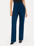 Woman wearing navy blue high-waisted wide-leg ponte pants with black pointed-toe heels.
