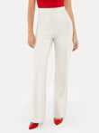 High-waisted white wide-leg ponte pants with a flattering tummy control design.