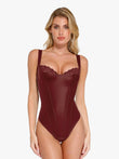 Woman in a deep red faux leather and lace balconette tummy control bodysuit.