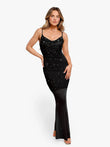 Model in Popilush® black slip maxi dress with rhinestones, showcasing elegance and a flattering fit.