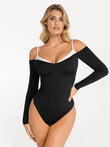 Black long sleeve cold shoulder shapewear bodysuit with contrasting trim and tummy control.