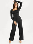 Black long sleeve shapewear jumpsuit with square neck and slimming wide legs.