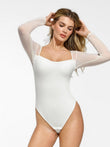 White square neck bodysuit with sheer mesh sleeves