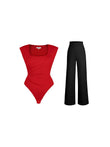 Red square-neck padded shoulder bodysuit with black wide-leg pants.
