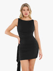 Black ruched bodycon mini dress with asymmetrical cascade detail and boat neckline.