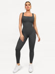 Grey ribbed seamless shapewear jumpsuit with square neckline and body-con fit.