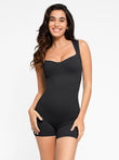 Black seamless sweetheart neckline shapewear romper with ribbed texture and shorts.