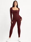 Seamless burgundy long sleeve shapewear jumpsuit with square neck and thumb holes.