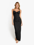Woman in a Popilush® black shaping maxi dress with ruched detailing