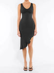 Seamless sleeveless black shapewear dress with deep V-neck and ruffled irregular hem.