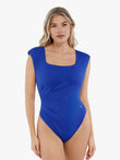 Blue shapewear bodysuit with square neck, padded shoulders, and ruched waist.