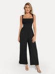 Black shapewear jumpsuit with square neckline, wide leg, and adjustable tie detail on the hem.