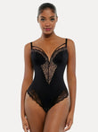 Black strappy shapewear bodysuit with lace inset details and tummy control features.