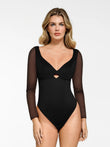 Black sculpting bodysuit with sheer mesh long sleeves, sweetheart neckline, and keyhole cutout.