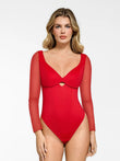 Red sculpting bodysuit with sheer mesh long sleeves, sweetheart neckline, and keyhole cutout.