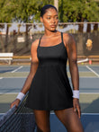 Black shapewear tennis dress with crisscross back, A-line skirt, pet hair resistant.
