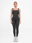 Grey seamless square neck shapewear jumpsuit with butt lift feature.