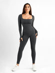 Dark grey seamless long sleeve ribbed jumpsuit with square neck and thumb holes.