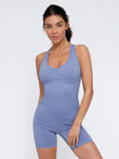 Periwinkle seamless sport crossback shapewear romper, ribbed texture, supportive fit.