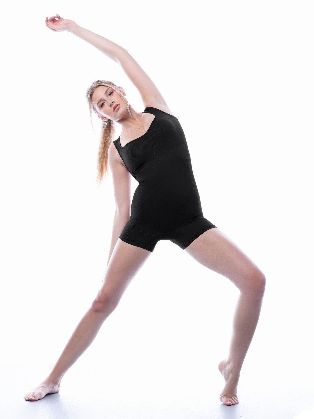 Popilush® black Seamless Sweetheart Neckline Shapewear Romper. Woman in active pose wearing comfortable body shaper.