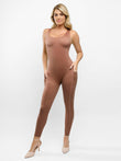 Brown U-neck shapewear jumpsuit with thigh slimming and butt lift features, side pockets.