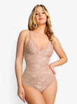 Rose pink lace thong bodysuit with adjustable straps and v-neck.