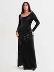Black velvet draped long sleeve sculpting column gown with thigh-high slit