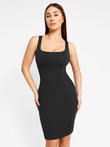 Black sleeveless shapewear midi work dress with sculpting square neckline.